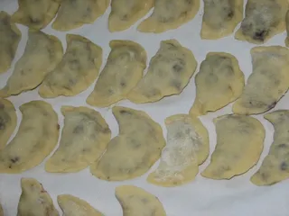 Pierogi z jagodami w śmietankowej polewie - 9